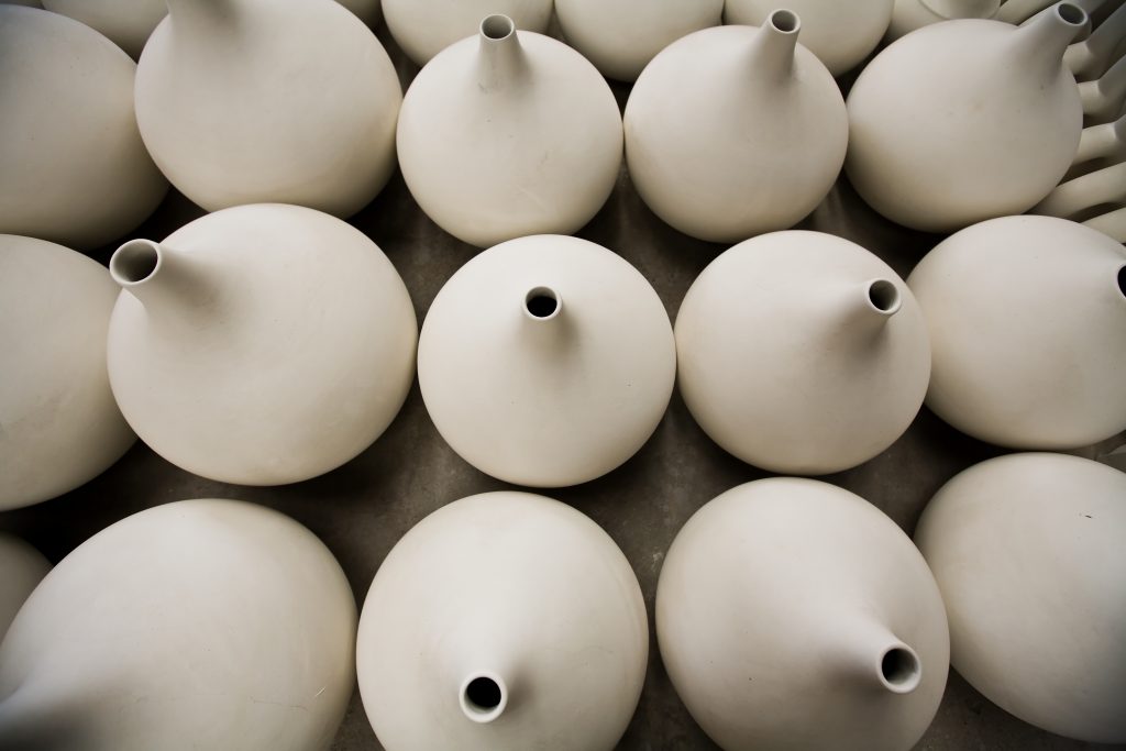 Unfinished porcelain pottery waiting to be fired in a kiln